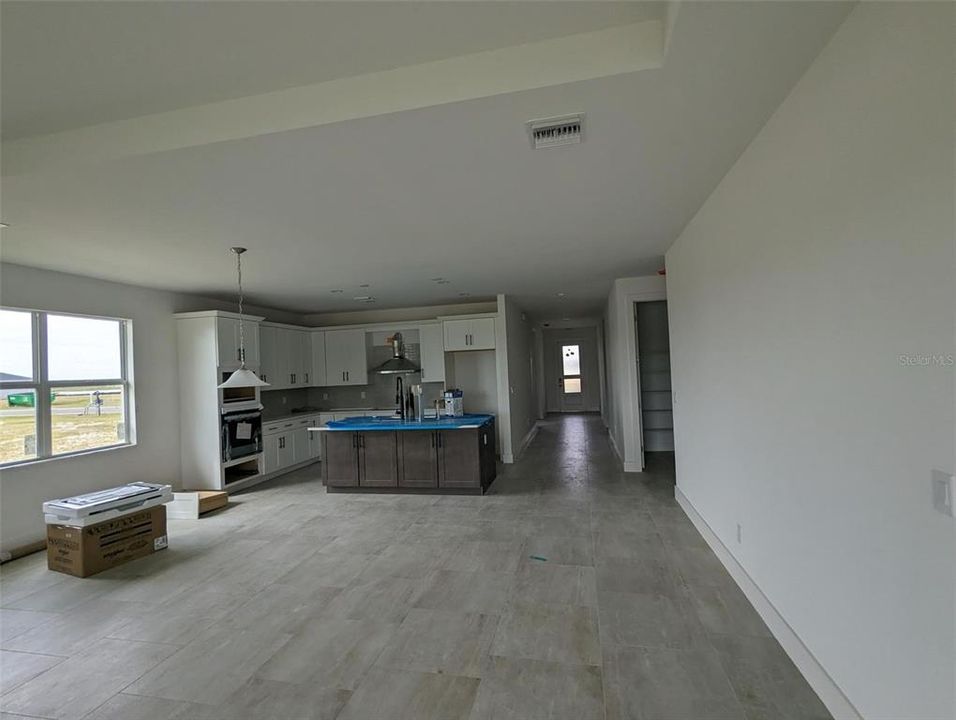 Great room and kitchen area from sliding glass doors to backyard