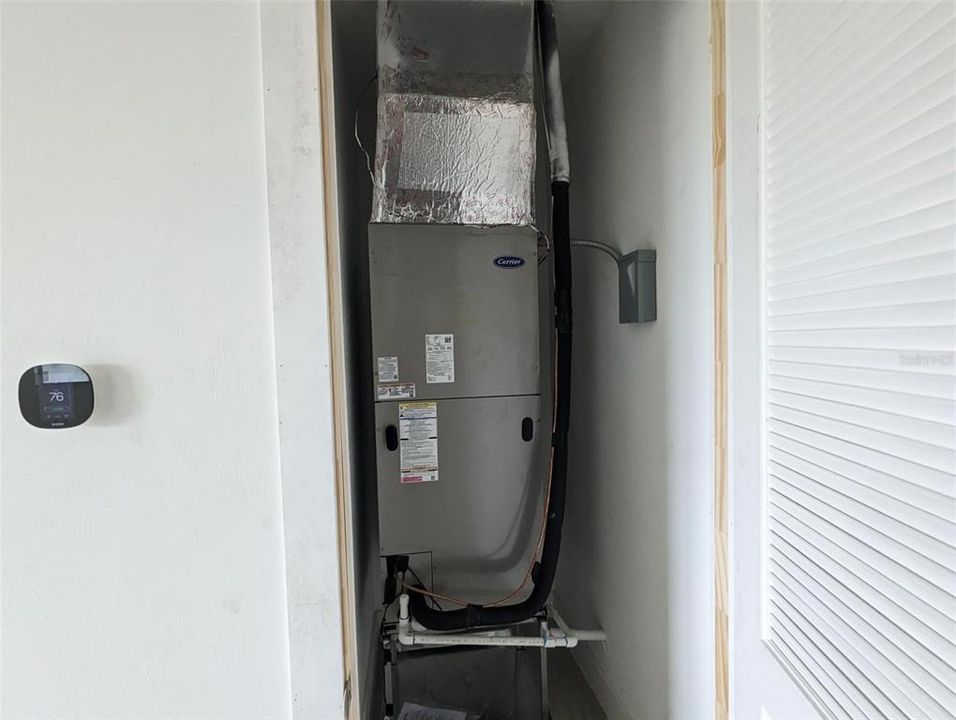 HVAC Carrier in electrical closet