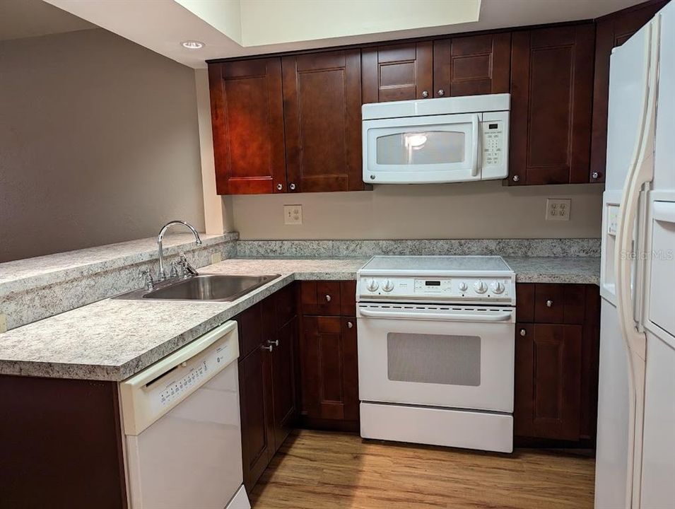 Kitchen with granite counters, updated cabinetry
