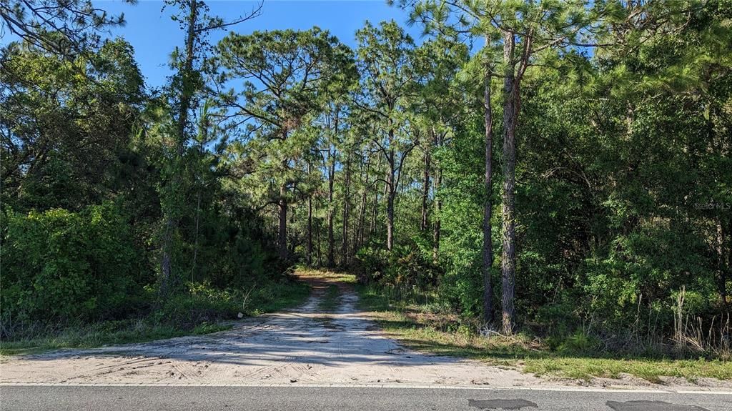 This street is called Farmingdale and is the rear entrance to your land on a Private Road just off of Highway 474...your land is a ways down on the left hand side at the end of the road, just before the private GATE.