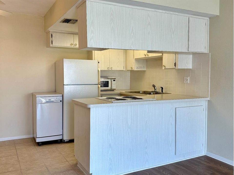 This spacious kitchen is ready for laughter and delicious meals to be shared.