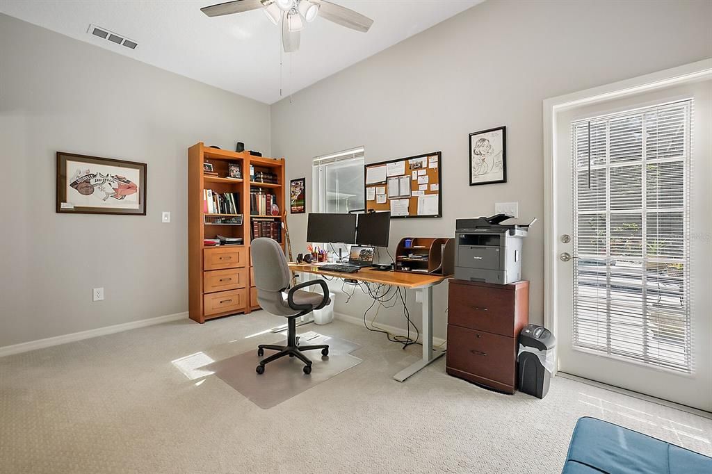 Bedroom area of the In-law suite has a door leading to the pool and lanai. It is equipped with its own HVAC, Septic, and full bath and plumbed for kitchen