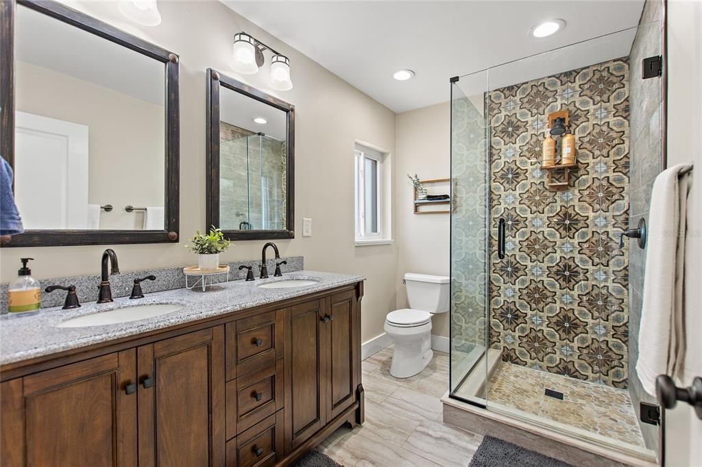 Primary Bathroom with dual vanity sinks and custom tile