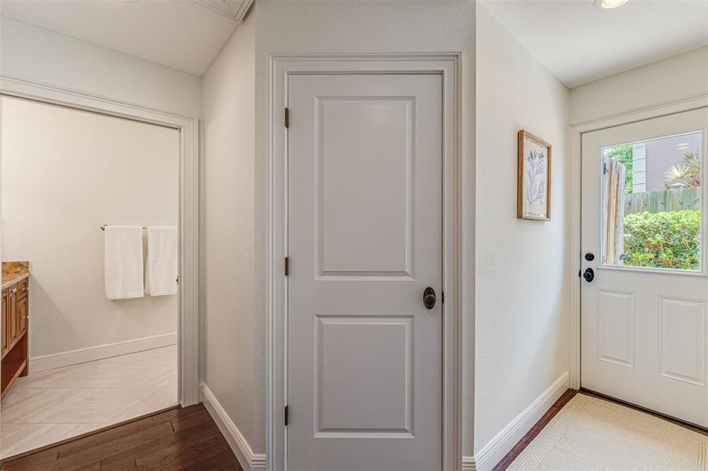 Guest Suite Walk-In Closet, Door to the Exterior, and Bathroom