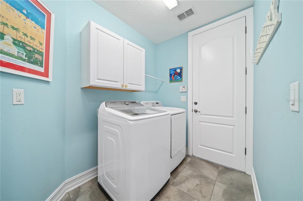 Level 1 indoor laundry with access to the garage.