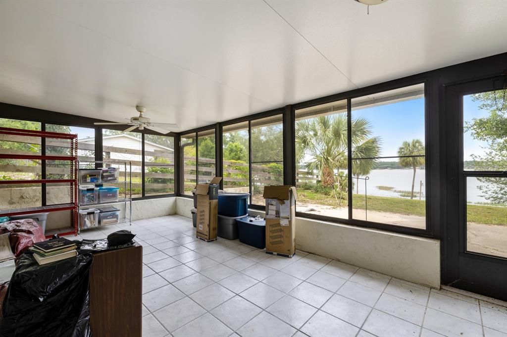 Downstairs Enclosed Florida Room that opens to the lake side