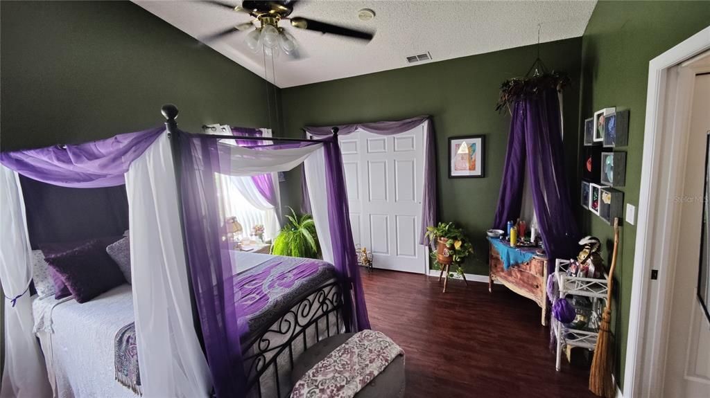 Master bedroom features a third closet and a comfortable ceiling light/fan