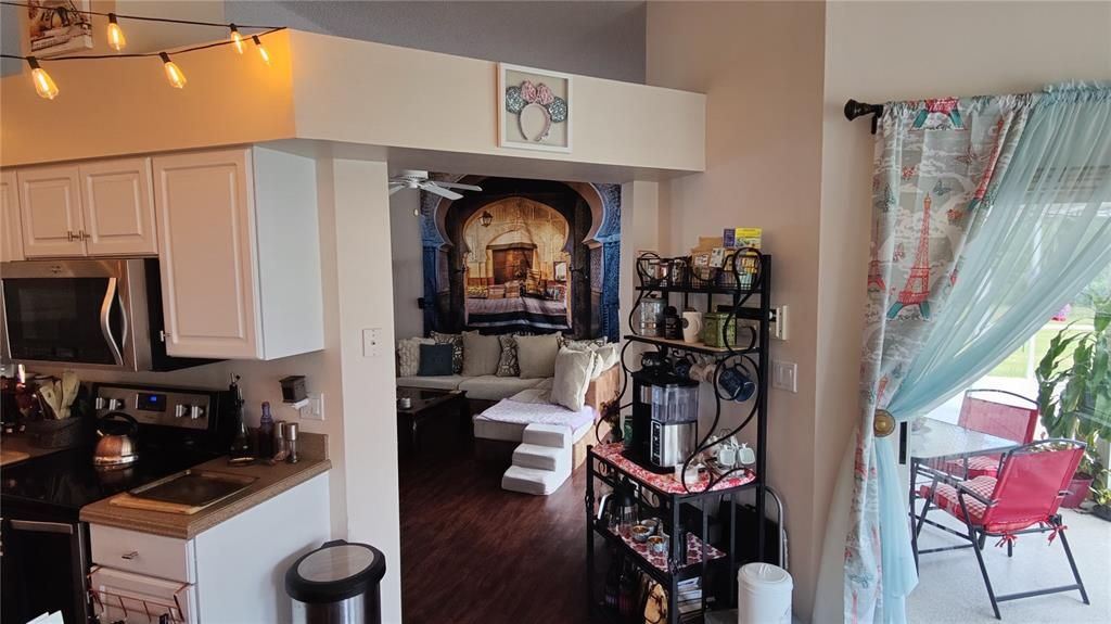 Kitchen on the left, great room straight ahead, lanai to the right, display shelf above