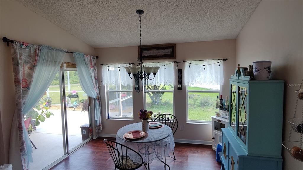 Breakfast nook is great place to enjoy your morning coffee while enjoying the back yard garden view