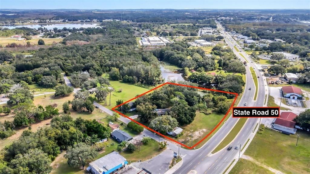 2 adjacent parcels. One zoned residential and the other commercial with frontage on highway 50