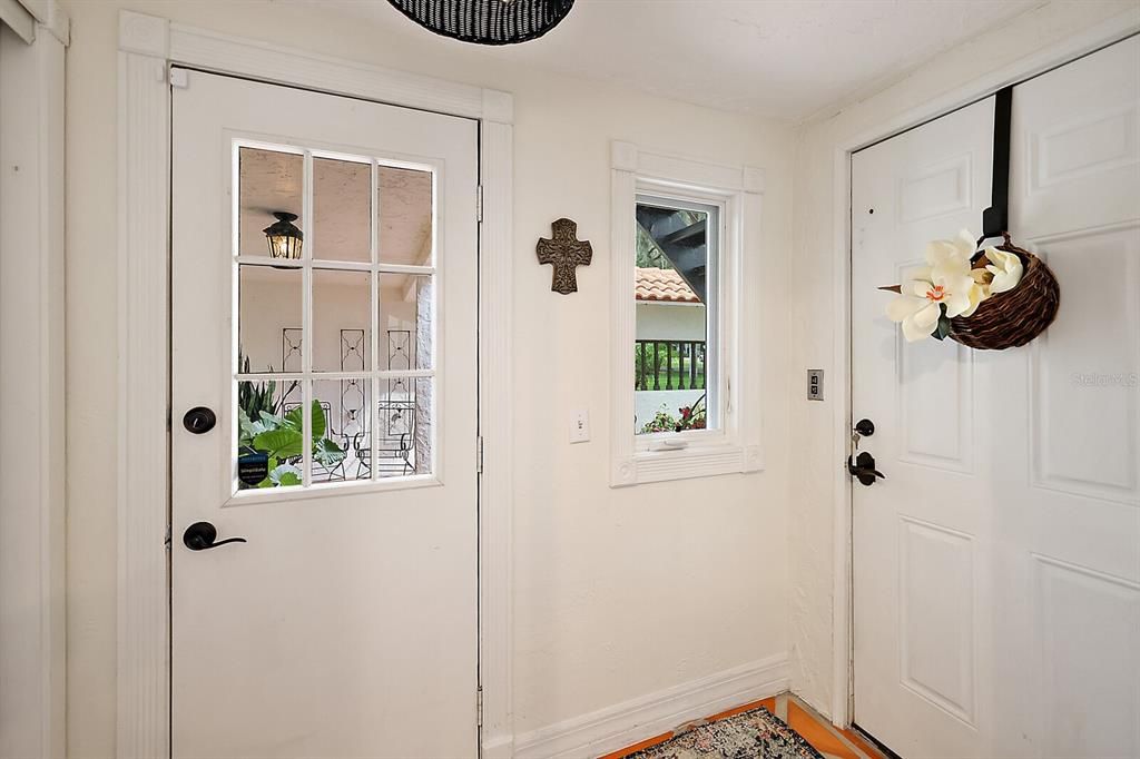 Utility room hallway leads to Courtyard access and inside access elevator to second level.