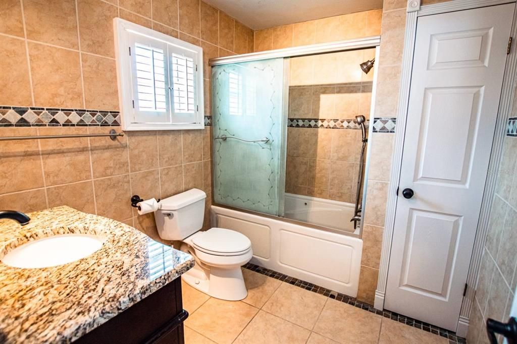 Master bathroom with one sink and a jetted spa tub & shower!