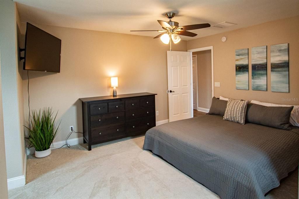 Upstairs 4th bedroom with King Bed, dresser & 55" TCL Smart TV (sleeps 2).