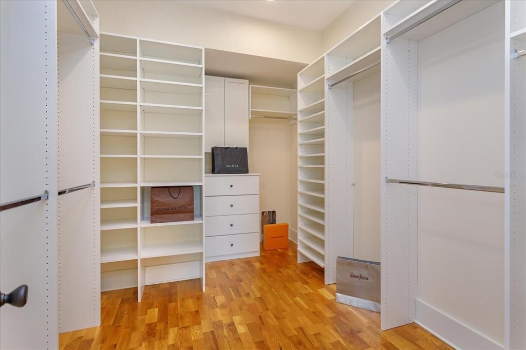 Master Bedroom walk-in closet with built-in shelving and washer-dryer hook-up