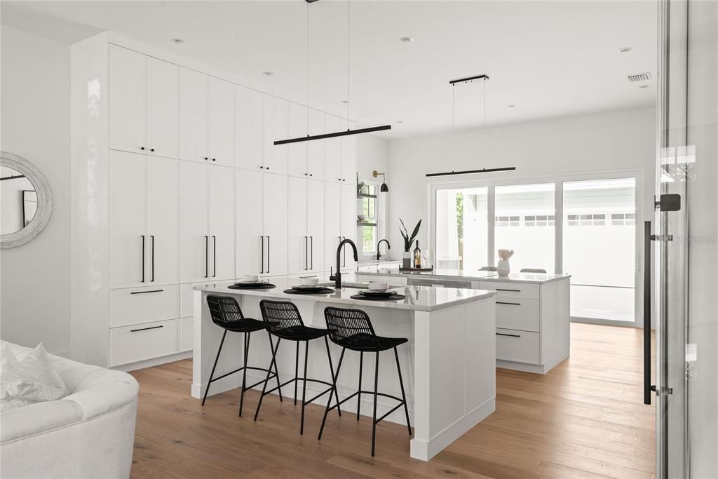 Modern refined Kitchen with floor to ceiling slim shaker cabinets