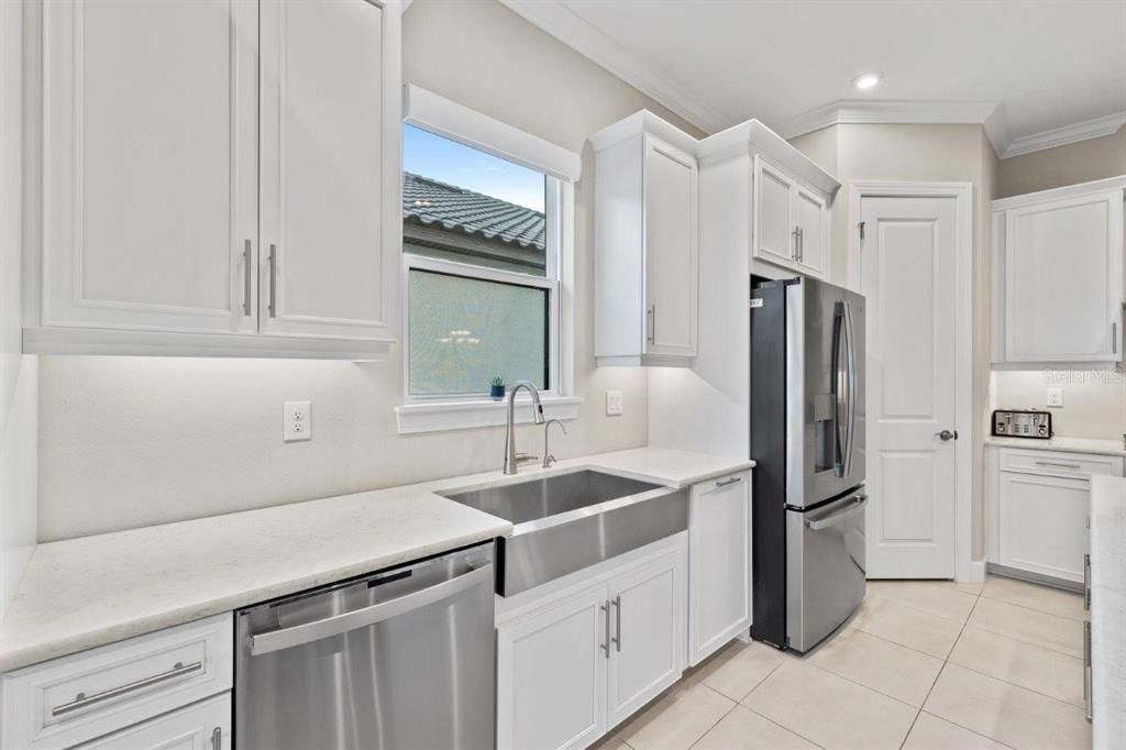 Extended Gourmet Kitchen featuring upgraded GE Profile appliances, and 42" wood cabinetry