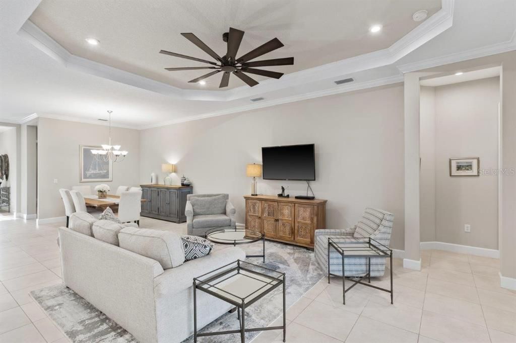 Living Room with 11' tray ceilings, and dual sliding glass doors.