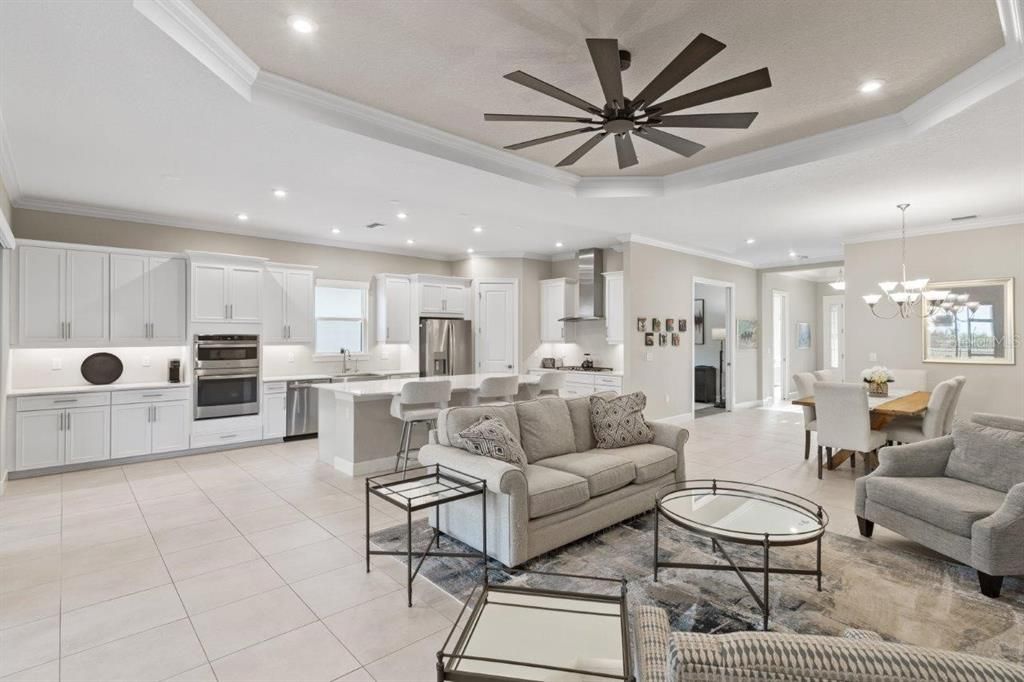 Living Room with 11' tray ceilings, and dual sliding glass doors.