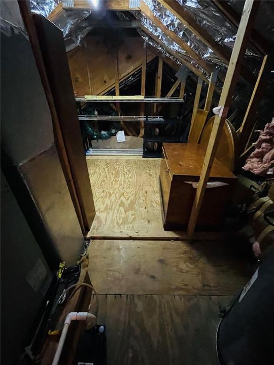 Walk-in attic storage space.
