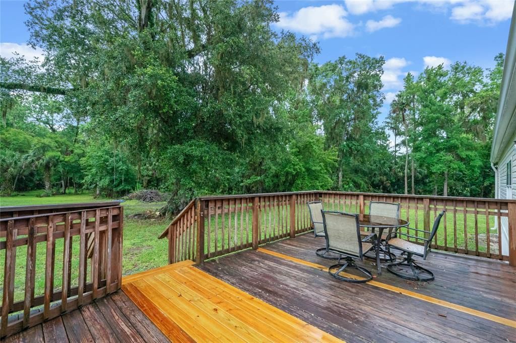Access the wood deck and gorgeous backyard from the sliding glass doors in the family room.