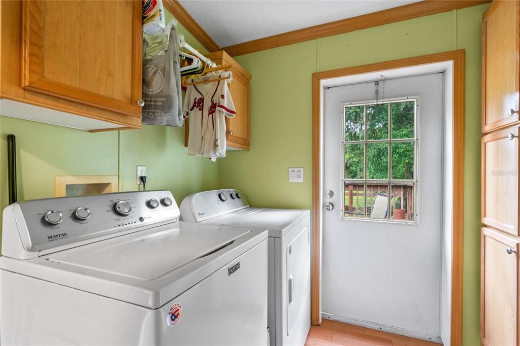 Laundry room with door leading to the backyard also has access to bathroom 3.