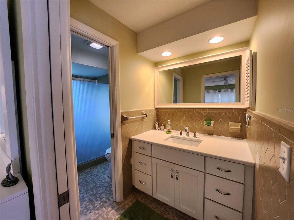 The Master Bathroom has a large vanity and private shower and toilet.