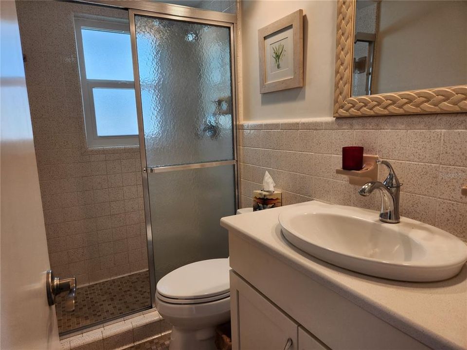 Bathroom #3 is convenient for all guests and serves Bedroom #3 and the Office/4th Bedroom