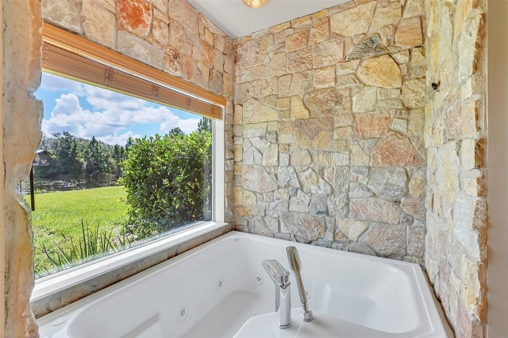 Two-person whirlpool tub with magnificent view overlooking the lake.
