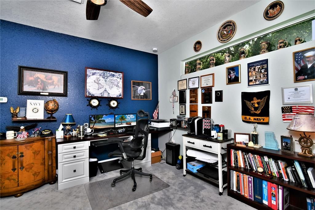 This could be a second living room but is used as a spacious home office.