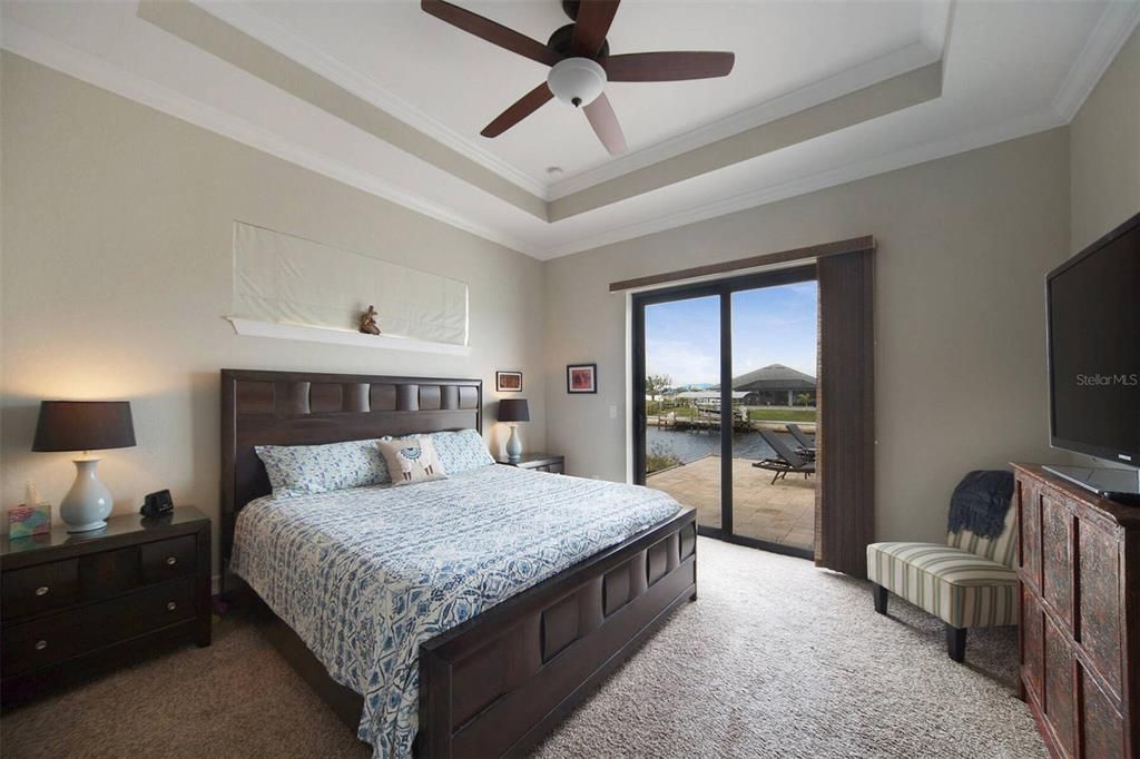 Master bedroom with sliders to pool area