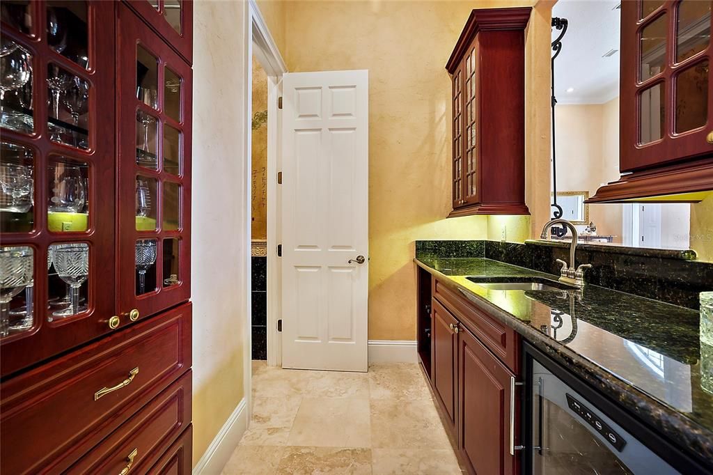 Butler's pantry; door is the entrance to the 1/2 bath (pool bath)