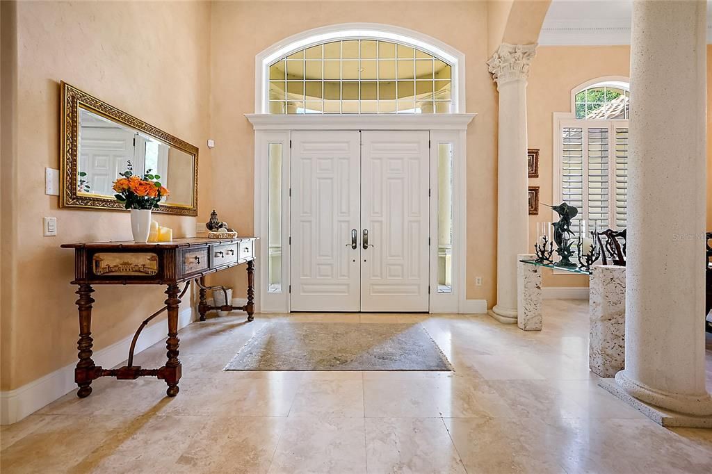 Foyer entry; Travertine floors flow throughout main living areas