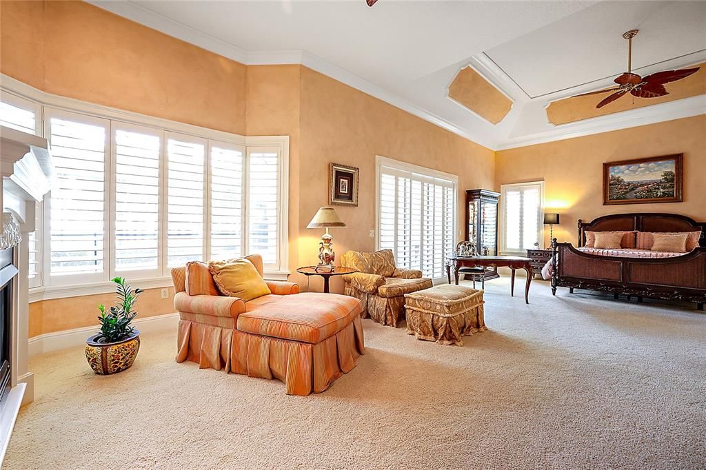 Owner's suite overlooks pool, lanai and Lake Harris