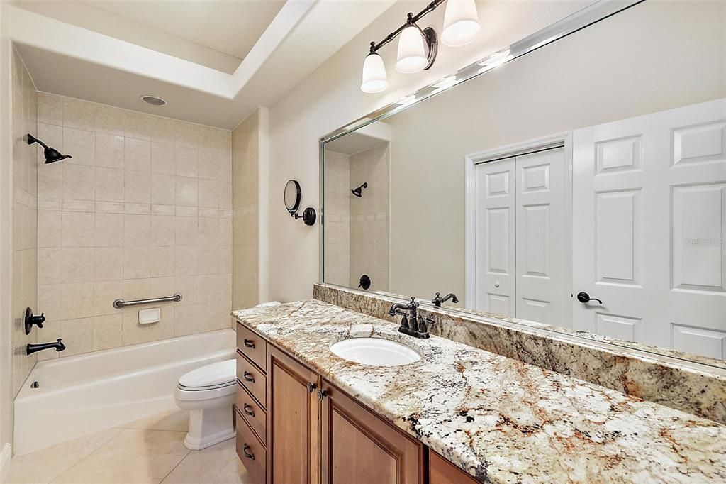 Guest bathroom w/tiled tub & shower combination