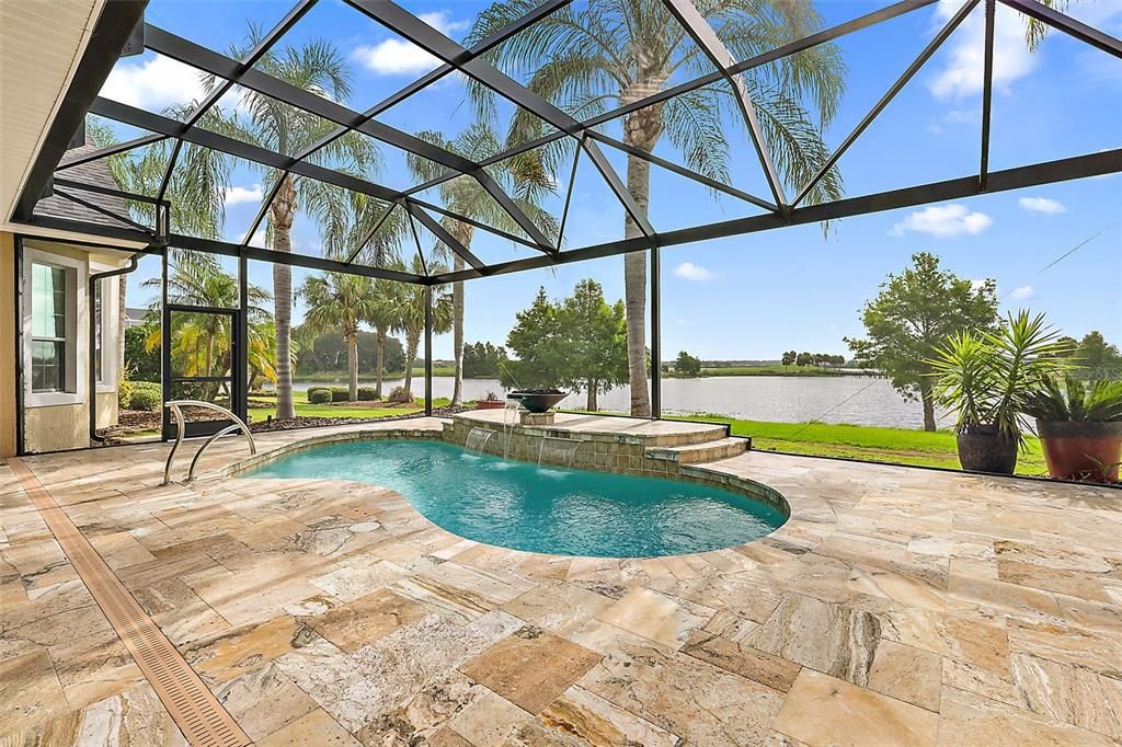 Travertine tile pool deck & huge birdcage