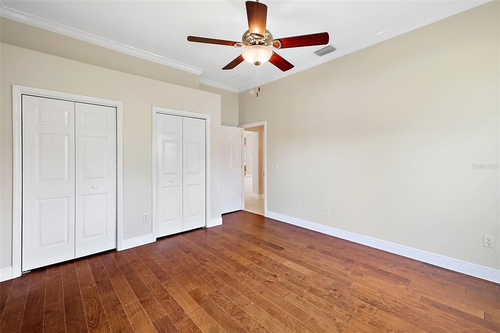 Bedroom 2 w/double closets & crown molding