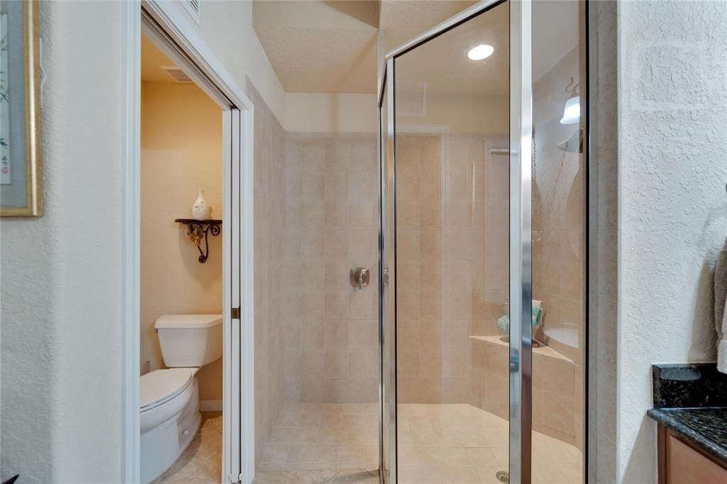 Walk in shower in the ensuite master bathroom with separate toilet room, with high toilets.