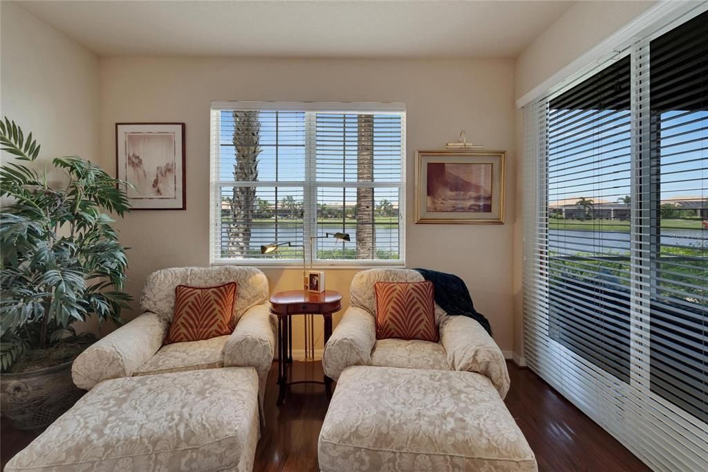 A double glass sliding door offers lots of natural sunshine and access onto the screened lanai.  This room is large enough to have it's own seating area.