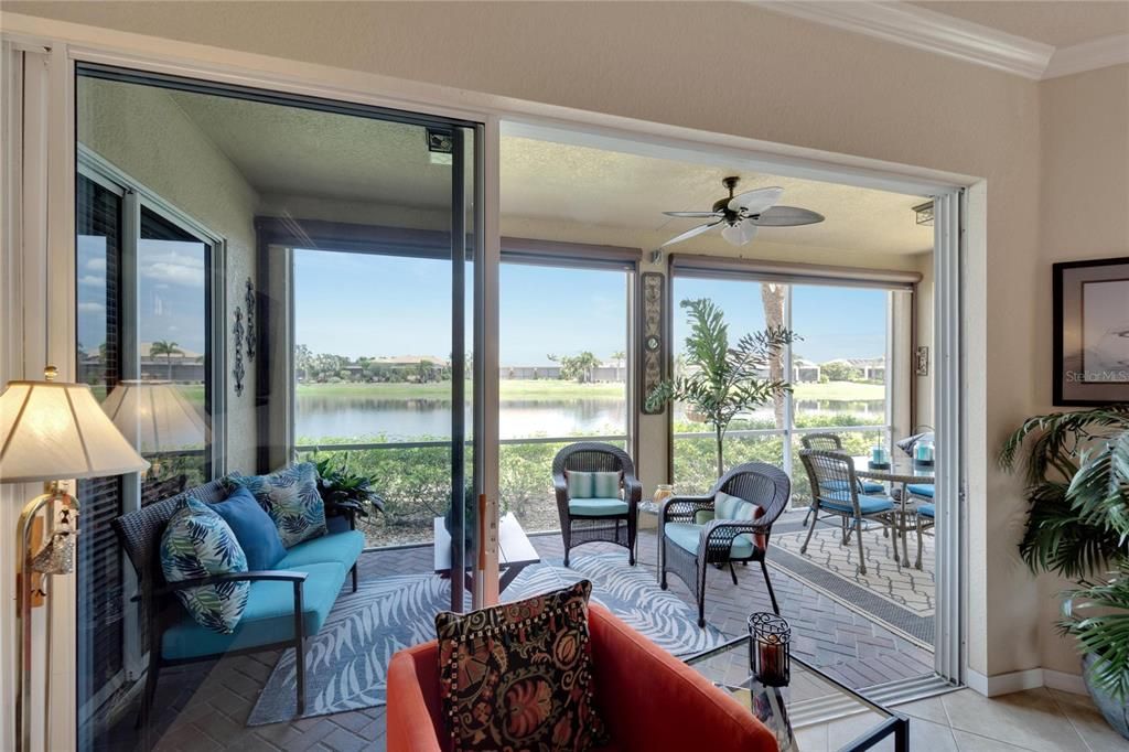 Bring the outdoors in, when living in this condo. A beautiful open living floor plan offers views from every room throughout the home. Three paned sliding glass doors easily open up to overlook a large pond water view.