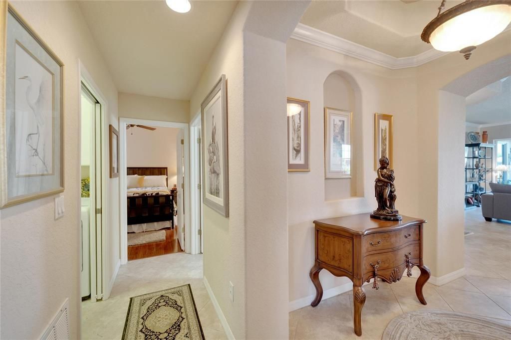 From the foyer, you walk into the other side of the condo with separate bedrooms, laundry room and bath. Notice how the architectural features highlight the home's elegance.
