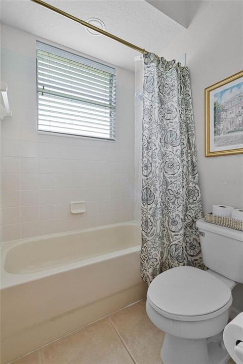 SHOWER/TUB COMBO, ENCLOSED TOILET IN JACK-AND-JILL BATHROOM
