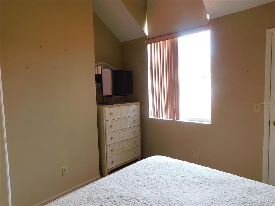 Bedroom with ample space for furniture.