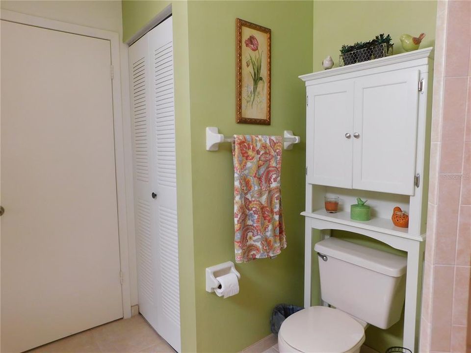 Bath has a nice spacious  floor plan. Door in photo is entry to bedroom. To the left is a door to bath from living area.