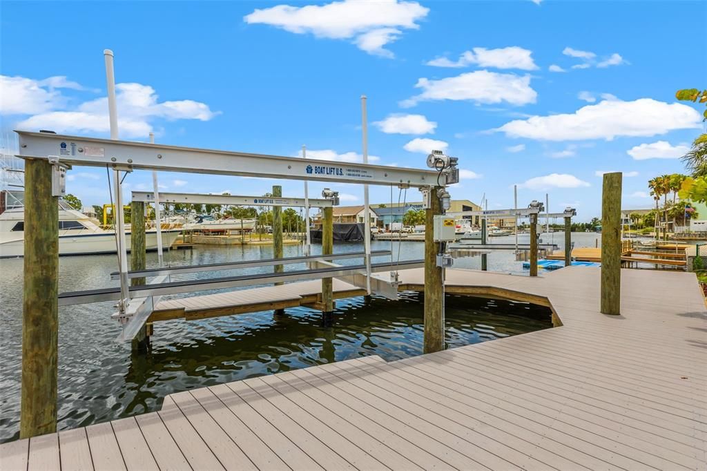 2 brand new boat lifts with remotes, 800+ feet of AZEK synthetic decking, wrapped poles, a 13000 lb lift, and a 10000 lb lift with two bunks for dual jet skis.