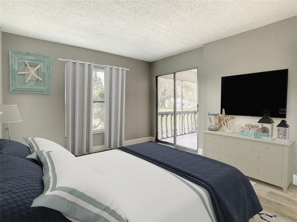 Virtually Staged- The bedroom also offers private access to this outdoor retreat through sliding glass doors and also enjoys a delightful second view from the large bedroom window