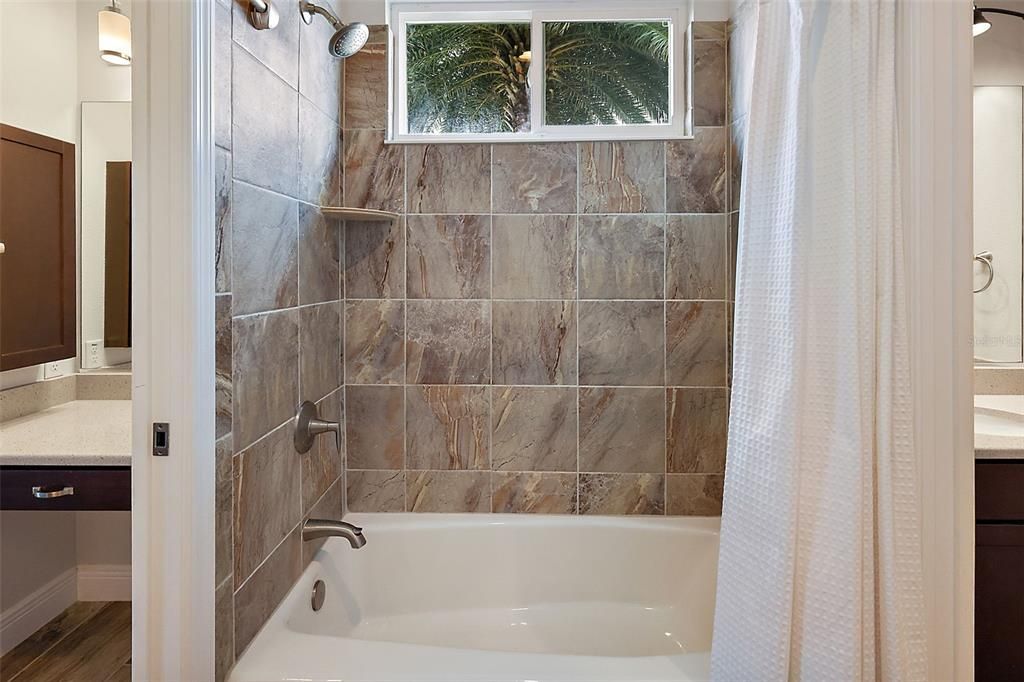 Guest bathroom w/tiled tub & shower combination