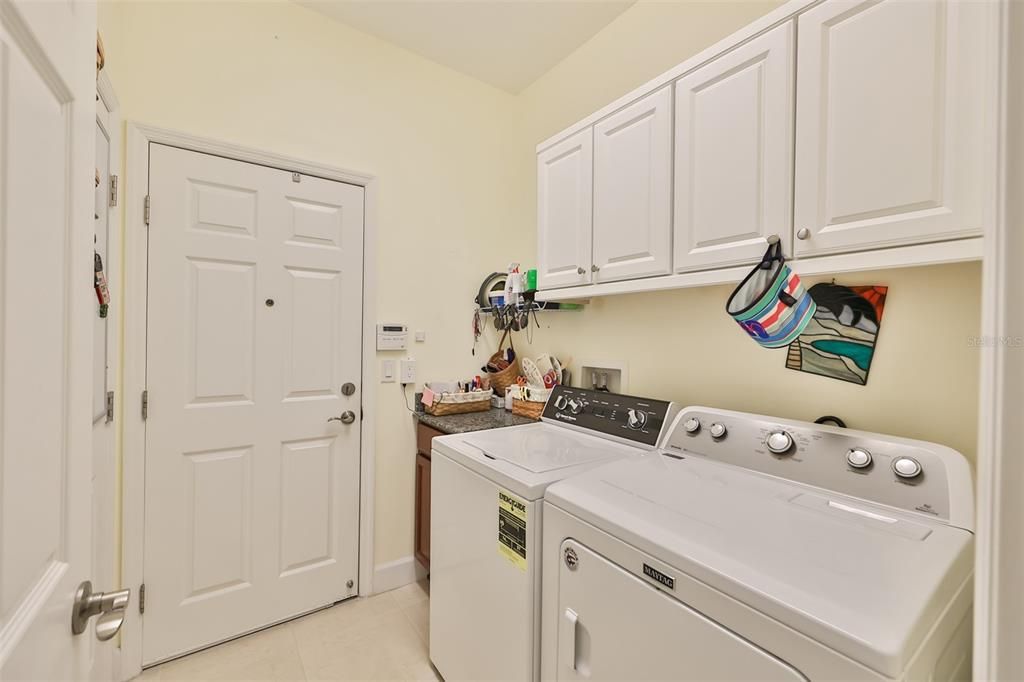 Laundry room with storage cabinets