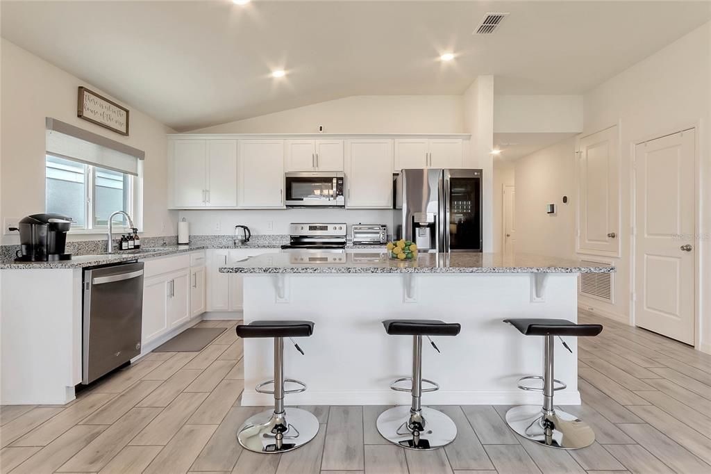 The kitchen is a chef's delight, offering both functionality and elegance.