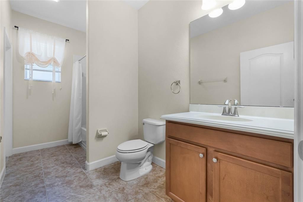 2ND MASTER SUITE BATHROOM: PRIVATE ENTRY FROM BEDROOM, SHOWER TUB COMBO, CERAMIC TILE FLOORING