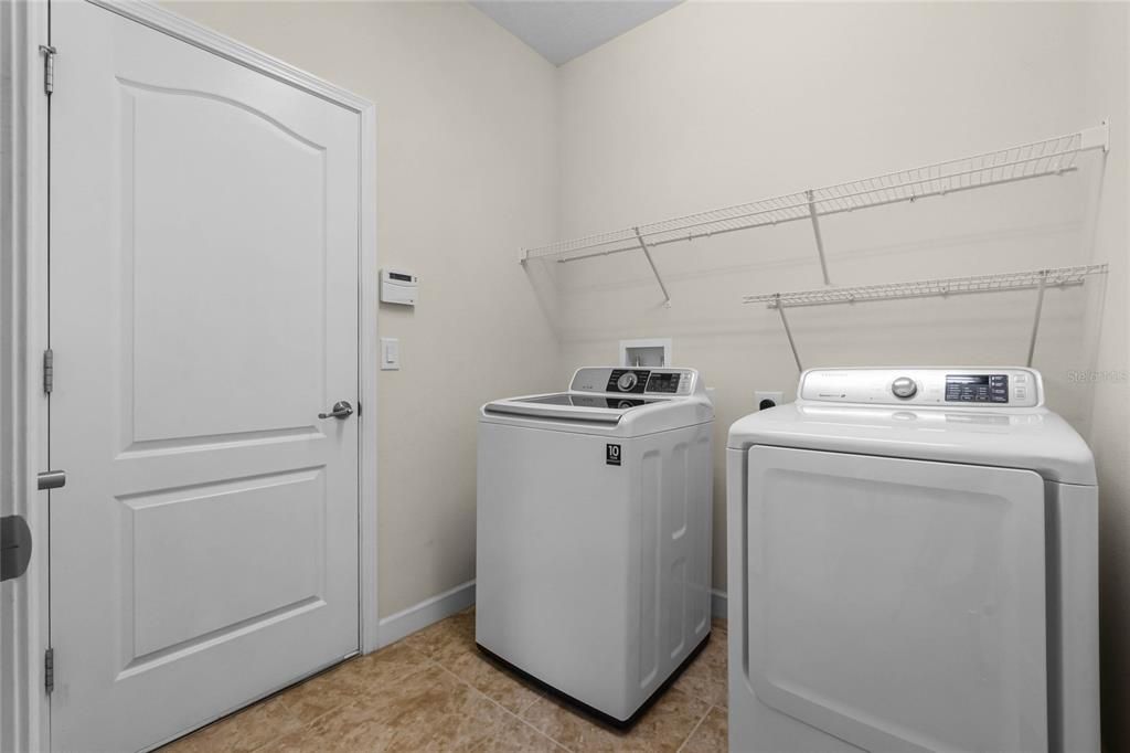 LAUNDRY ROOM: Door to 3 Car Garage, Washer/Dryer CONVEY IN THE SALE OF THE HOME